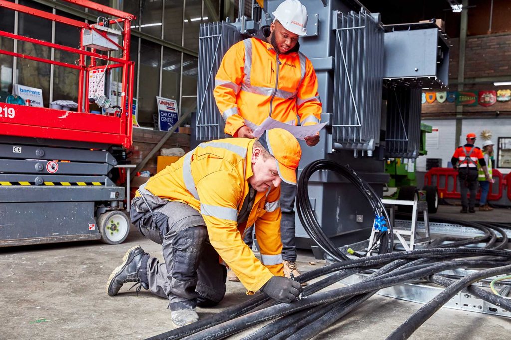 Zenobe project manager working with contractor on cabling